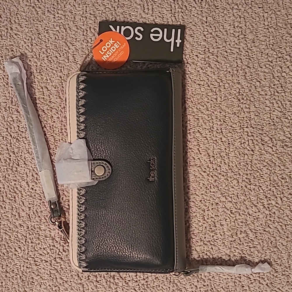 The Sak Iris smartphone crossbody purse. Dusty blue and grey leather.